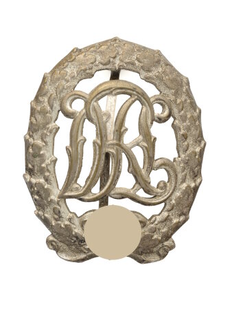 Metallanstecker mit Kranz und verschlungenen Buchstaben (DRL).