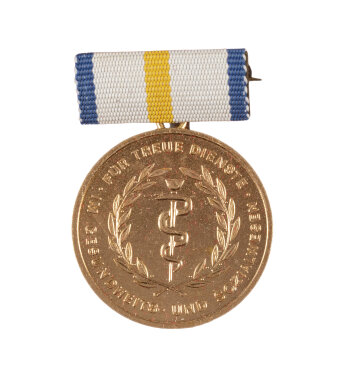 Goldmedaille mit Asklepiosstab, Lorbeerkranz und Inschrift „Für Treue Dienste im Gesundheits- und Sozialwesen“
