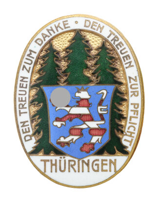Ovales Abzeichen mit drei Tannen davor ein Thüringer Wappen und Schriftzug drumherum.