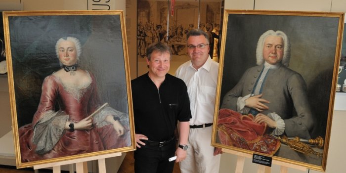 Hardy Eidam und Dr. Steffen Raßloff vor zwei Porträts